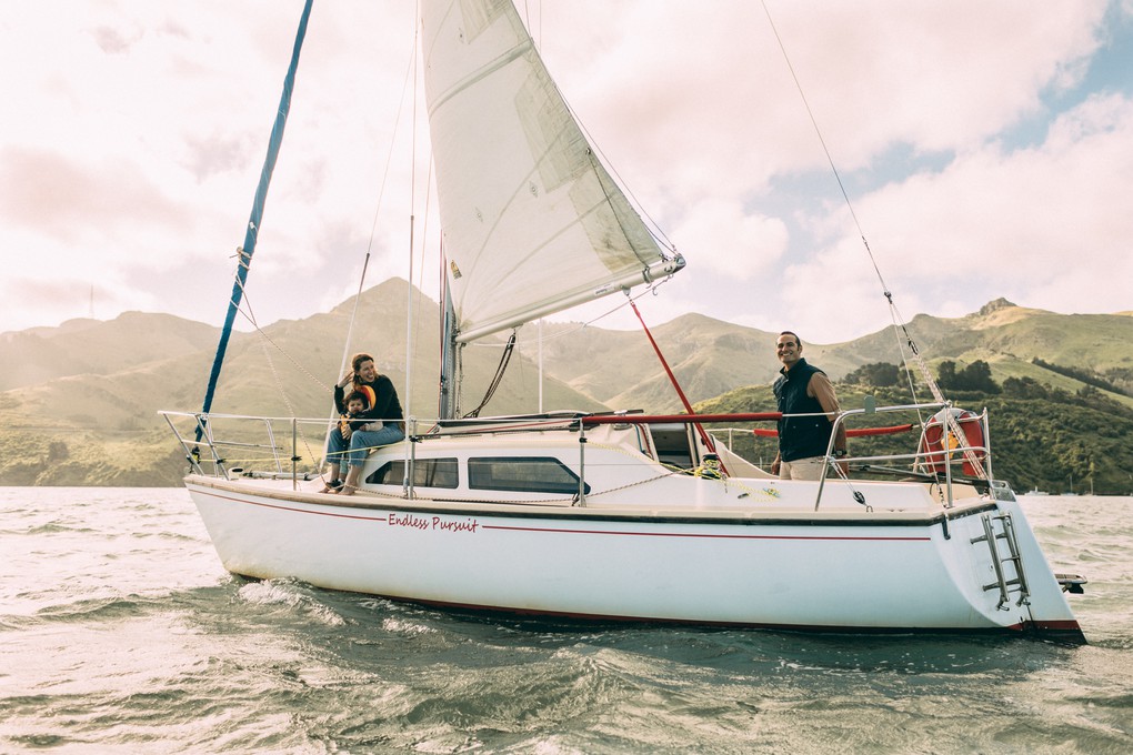 A family aboard a sailboat in Lyttelton Harbour, Christchurch